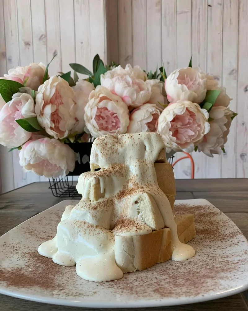 Harry's Volcano: a crisp bread tower under fresh cream and a dusting of chocolate